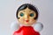 Classic Russian red toy `Nevalyashka` - roly-poly on the white, retro