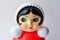 Classic Russian red toy `Nevalyashka` - roly-poly on the white, retro