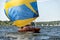 Classic sailing yacht with spinnaker on a lake in a regatta