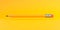 Classic sharp wooden pencil with rubber eraser flying on yellow background