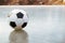 Classic soccer ball on a frozen pond