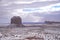 Classic southwest desert landscape with snow on the ground in Monument Valley