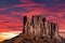 Classic southwest desert landscape under an evening sky and bright sun in Monument Valley