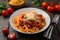 Classic spaghetti bolognese garnished with cheese and tomatoes