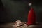 Classic still life with pomegranate fruit and red vase