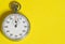 Classic stopwatch on a yellow background