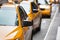 Classic street view of yellow cabs in New York city