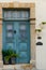 Classic style cyan wooden door house entrance and cat