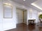 Classic style hall with white walls and built-in sliding wardrobe with golden frame