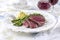 Classic style traditional sirloin beef steak with green asparagus and mashed potatoes on a design plate