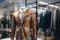 A Classic Suit in tiger color in a Clothing Store. Generative AI