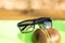 Classic Sunglasses design for men and ladies with black lenses and black frame shoot outside in a summer day closeup