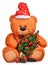 Classic teddy bear in red hat with christmas tree