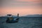 Classic Thailand sunset view with long tail boats