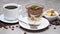 Classic tiramisu dessert in a glass, coffee, chocolate, cream and sugar on concrete background