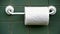 Classic toilet paper roll against a textured green tile background