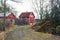 Classic traditional red wooden house in Scandinavia countryside, Finland.