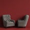 Classic tufted chairs in gray color in empty red room with relief stripe wall