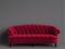 Classic tufted sofa red color in empty grey room with relief stripe wall