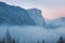 Classic Tunnel View of scenic Yosemite Valley with famous El Capitan and Half Dome rock climbing summits in beautiful atmosphere