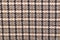 Classic tweed, Wool Background Texture. Coat close-up. Expensive men`s suit fabric. Glenurquhart check is made of woolen fabric wi