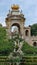 This classic two-tiered fountain and monument with an arch and a statue of Venus in the middle of it