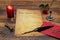 Classic Valentine`s Day cad with decorative quill and stand, red envelop with wax seal, red candle and rose, space for your text