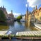 The classic view of Bruges depicting the Belfry tower and the Rozenhoedkaai area of Brugges, Belgium