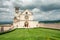 Classic view of famous Basilica of St. Francis of Assisi  in beautiful spring day light with dramatic clouds in the sky