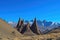 classic view of a mountain range, with jagged peaks and clear blue skies