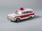 a classic and vintage ambulance tin toy car on grey background