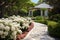 Classic and vintage pathway with green yard white rocks and flower bush