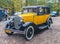 Classic vintage yellow Ford A car parked