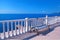 Classic white balustrade, bench and empty terrace overlooking th