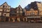 Classic wide-angle view of historical part city Rouen. Cozy square with ancient timber framing houses and open air cafe