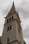 Classic wide-angle view of tower of Saint Martin`s Church against cloudy sky. Bled Lake, Slovenia