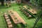 Classic wood with steel rim tables and chairs are arranged in the little garden, shot from 2nd floor