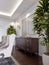 Classic wooden chest of drawers with sliding cabinets and empty paintings and sconces on the wall in the dining room