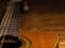 CLassic wooden guitar body close-up view