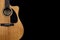 Classic yellow acoustic guitar Fender CD-60 with black pickguard on isolated black background with space for text