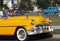 Classic Yellow Car With White Wall Tires In Havana