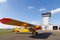 Classic yellow Piper Cub aircraft