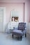 Classical armchair and mirror table at living room interior