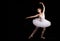 Classical ballerina in a white skirt