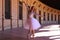 Classical ballet dancer dancing and doing different ballet postures. The ballerina is wearing a white tutu. Ballet concept