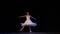 Classical ballet female dancer on pointe doing elements of classical ballet. Ballerina in white skirt appear weightless