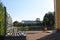 Classical baroque bench in the green garden and summer sunny lake in the Catherine park, Pushkin, St. Petersburg