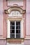 Classical colorful window with pediment in Prague