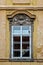 Classical colorful window with pediment in Prague