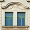 Classical house windows with green frame, Germany